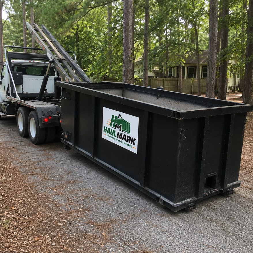 Roll-off dumpster delivery setup for a residential cleanup